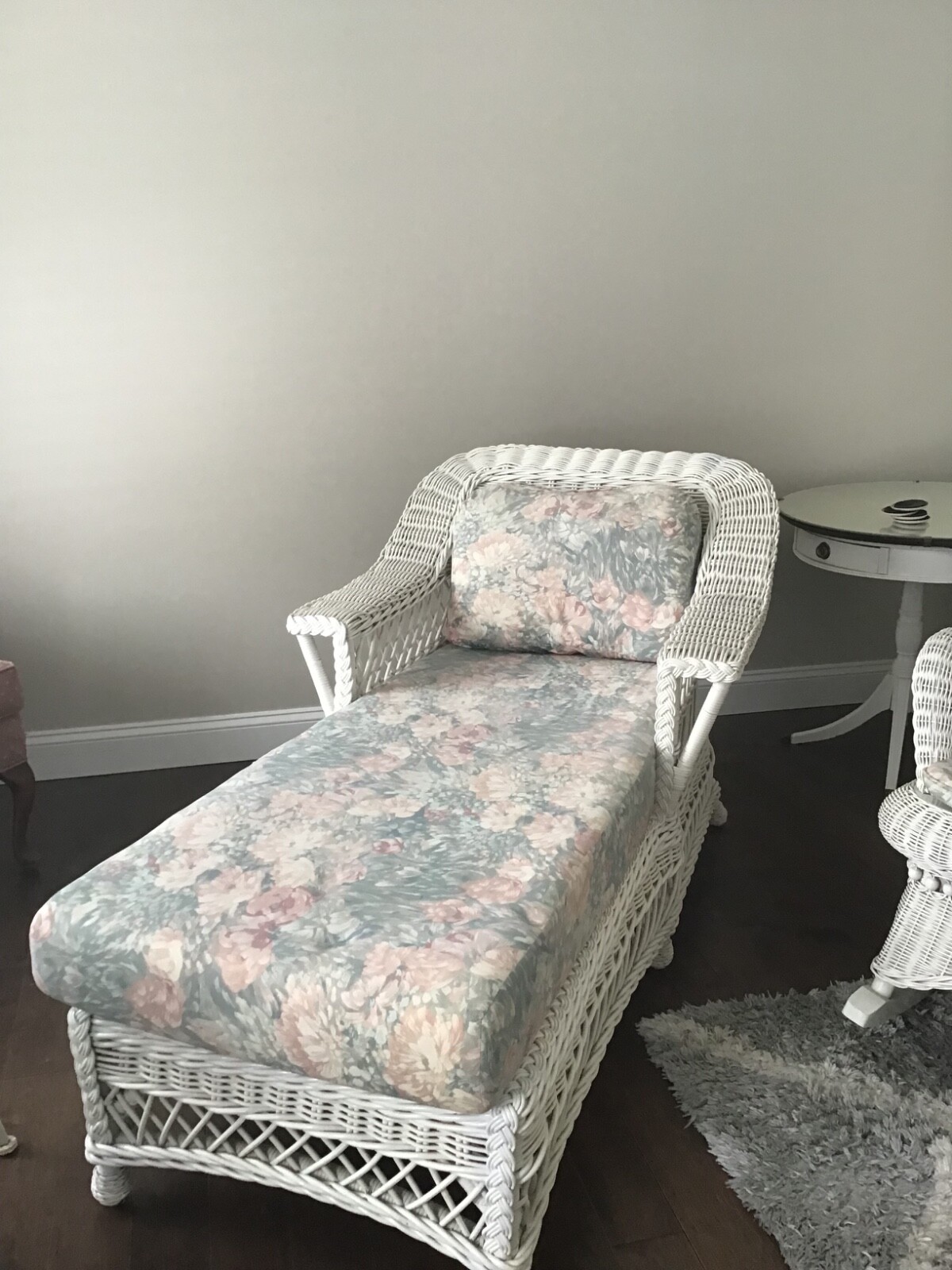 White wicker furniture used. Settee, chaise lounge and rocker. Cushions include.