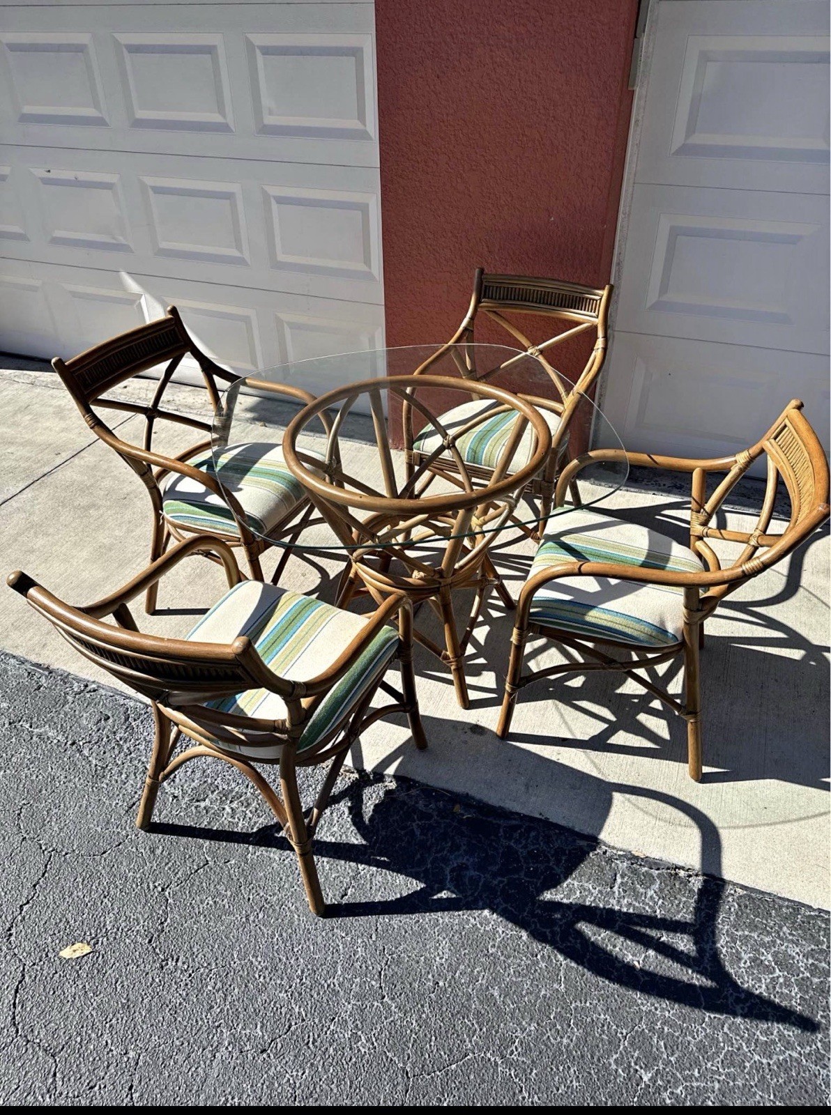 Patio rattan coastal set. Glass top table and chairs.
